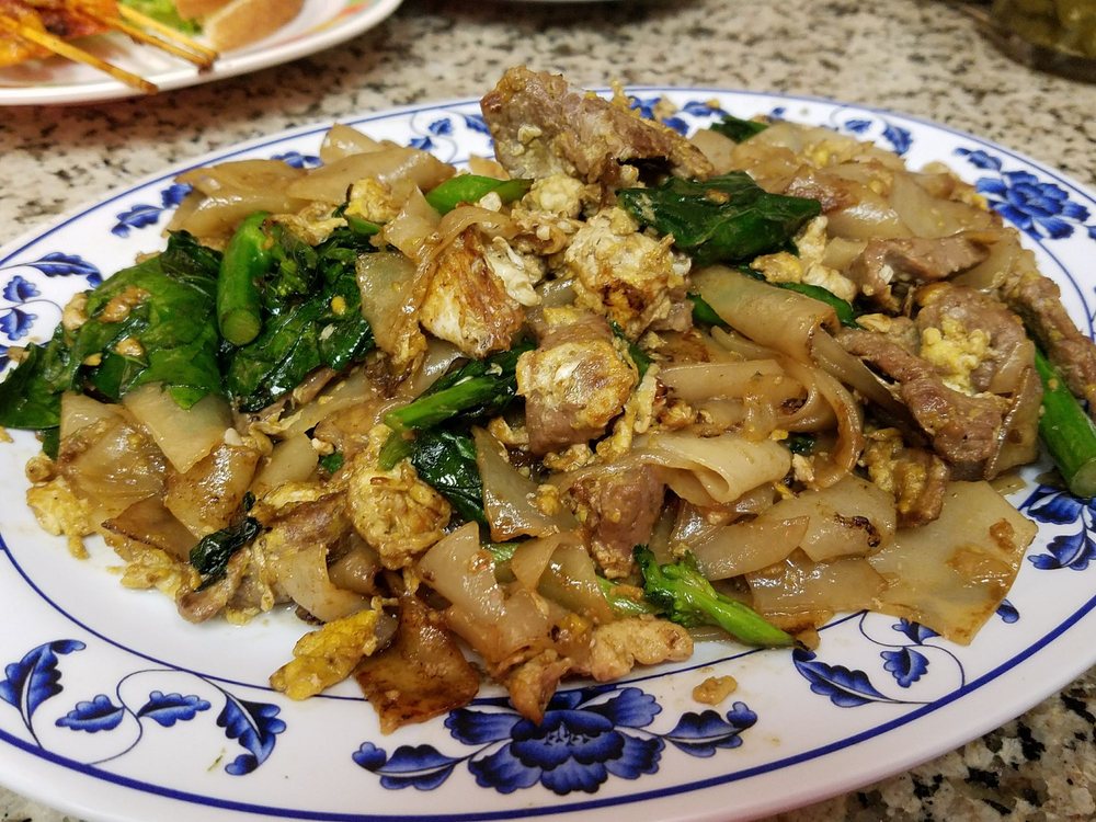 Pad see ew: wide rice noodles stir-fried with egg and Chinese broccoli