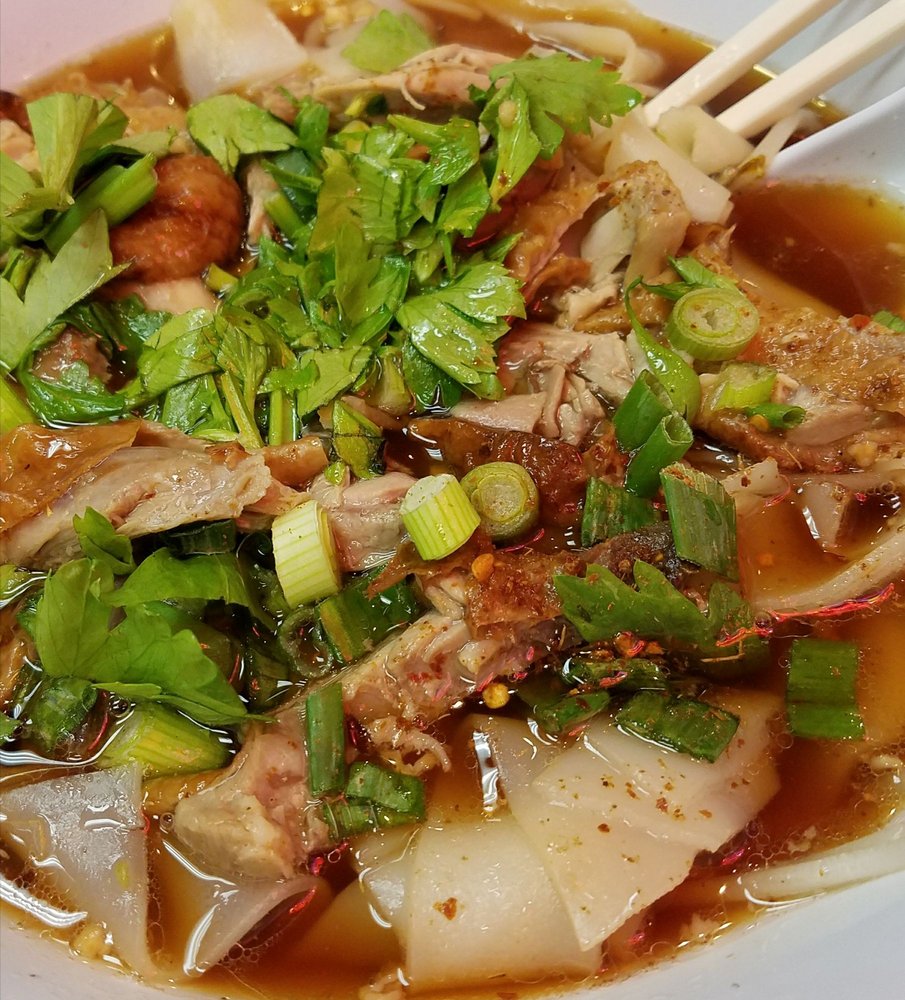 Noodle soup with pork, celery, cilantro and green onion